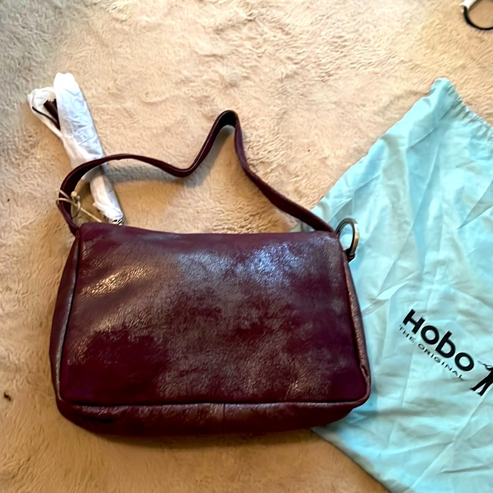 Gorgeous brand new bag from hobo. Plum leather shoulder bag with long strap